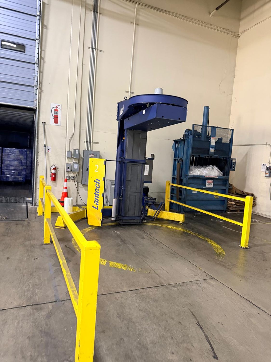Lantech rotary tower stretch wrapper on a warehouse floor